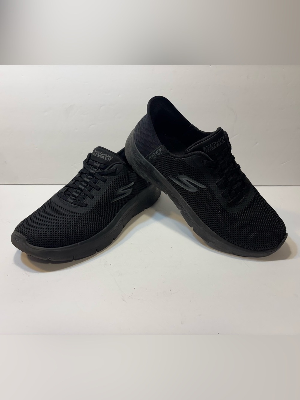 Skechers All-Black Slip-On Mesh Sneakers